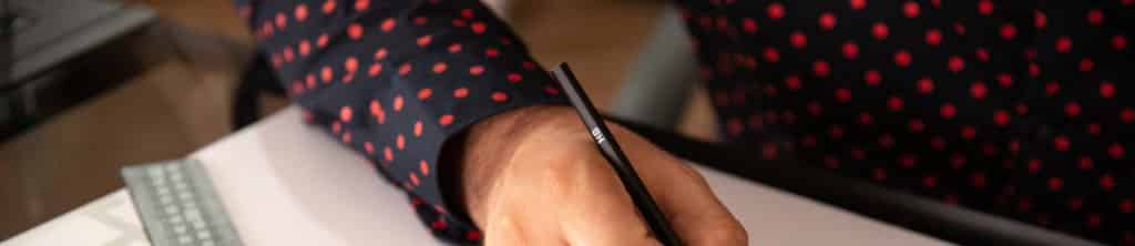 close up with male architect drawing a new project on the sheet