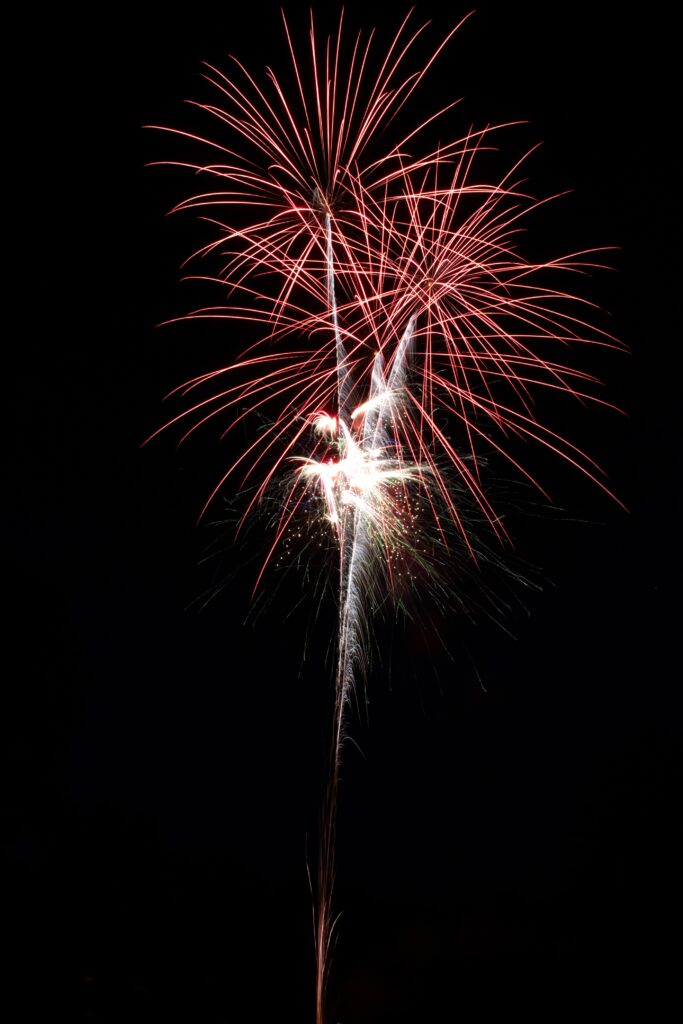 Vertical shot of beautiful fireworks at night time