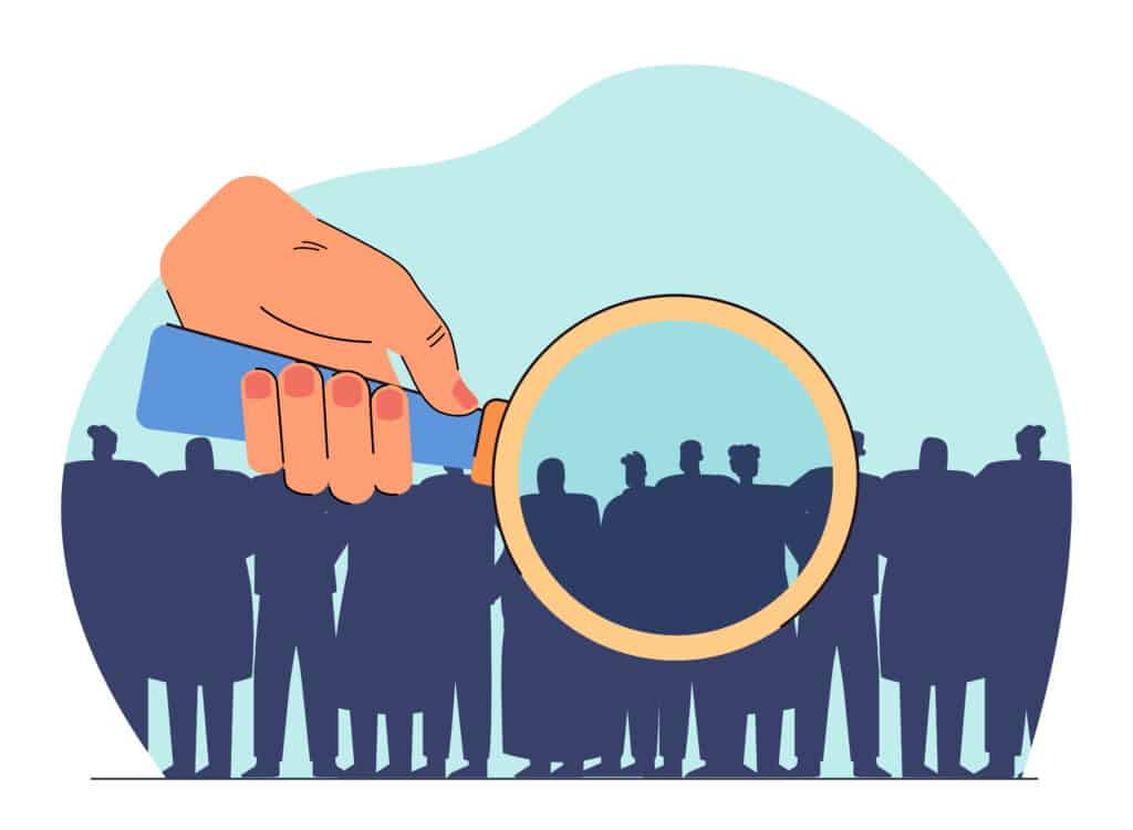Huge hand of manager examining crowd with magnifying glass